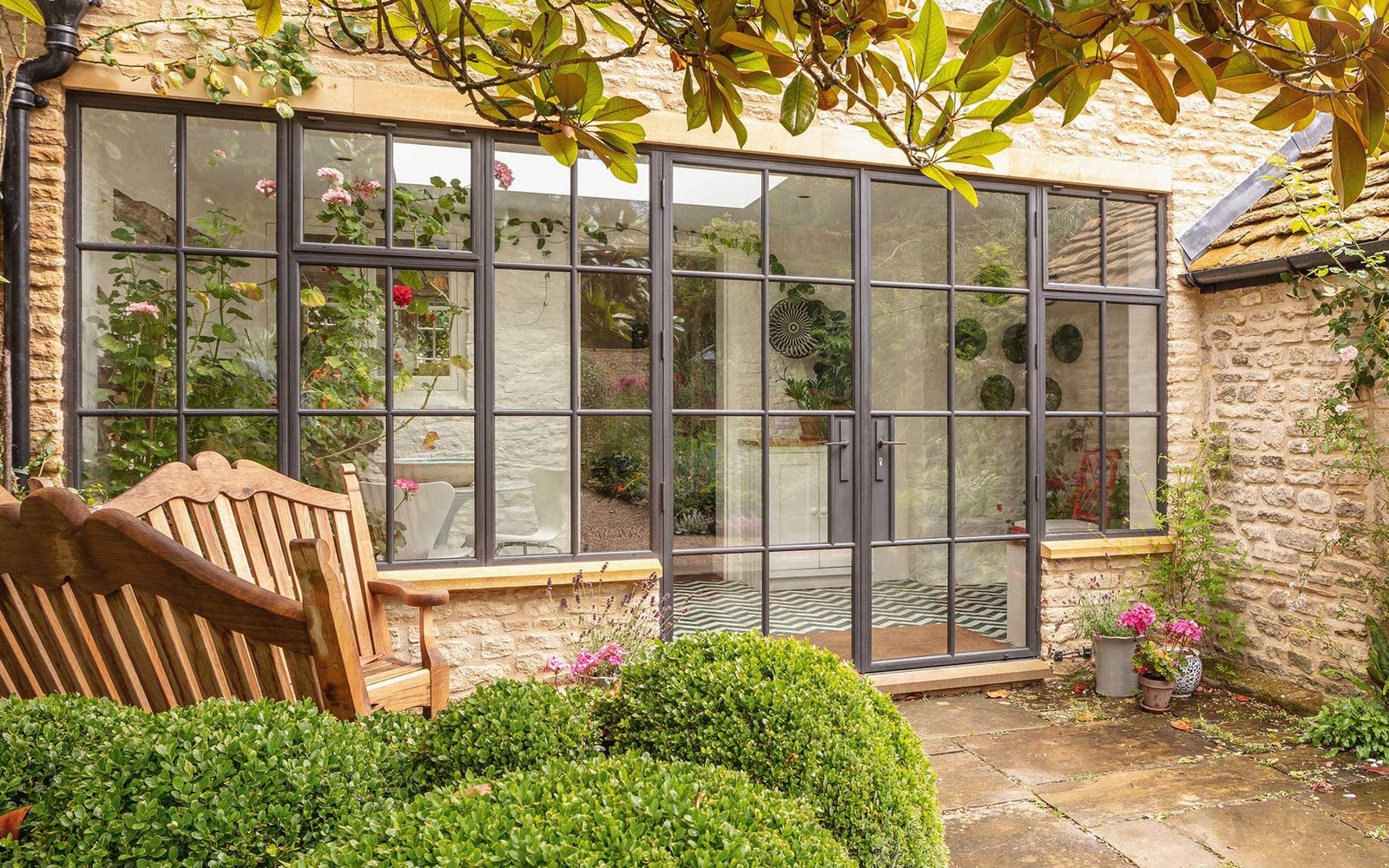 French doors opening onto a sunlit garden
